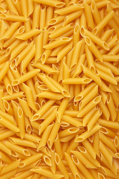 Penne Rigate Pasta Background Vertical Photo Top View — Stock Photo, Image