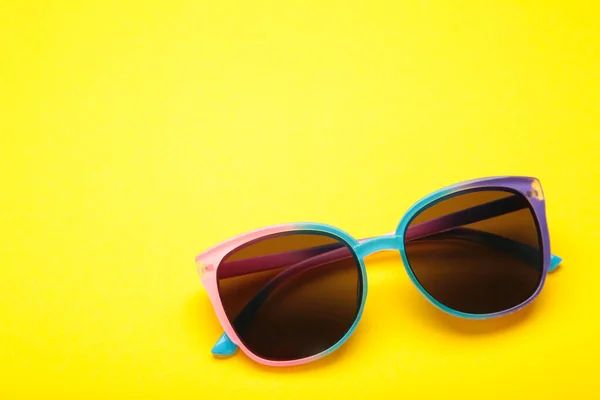 stock image Colorful sunglasses on yellow background. Space for text