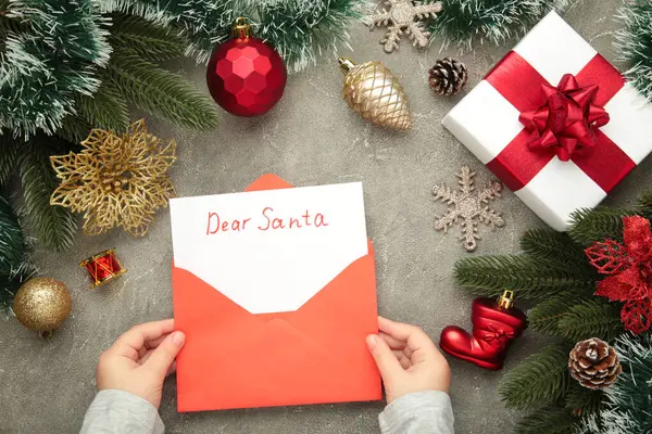 Christmas letter from a child to Santa Claus with the words: Dear Santa. Happy New Year. Top view