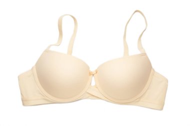 Beyaz arka planda izole edilmiş bej kadın sütyeni. Göğüs için sıkıştırılmış sütyen.