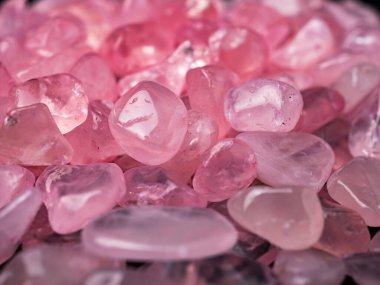 Macro shoot of tumbled rose quartz crystals, usually used for therapy