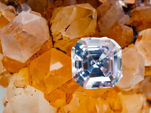 Sparkling asscher cut diamond on a rough crystal