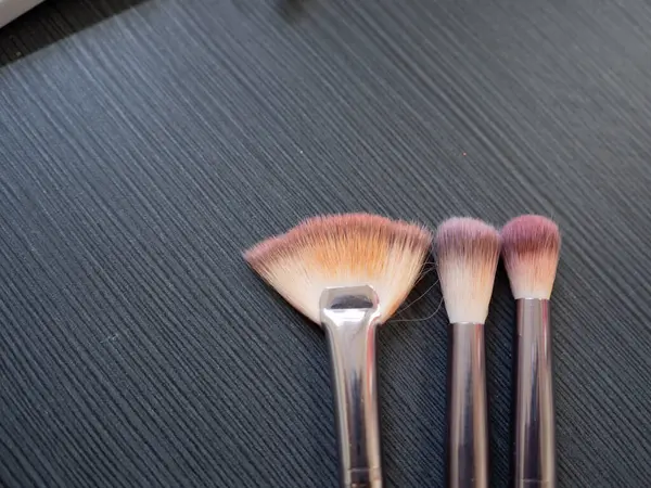 Makeup brushes on a black background. Make-up brushes.