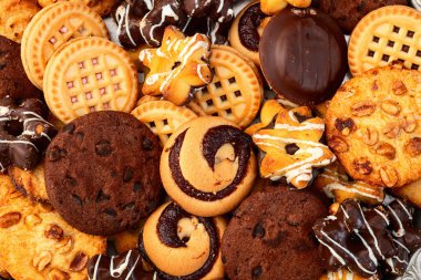 Kurabiye karışımı. Bir sürü sağlıksız atıştırmalık. Üst Manzara. Gıda arkaplanı