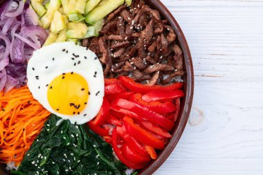 Bibimbap traditional korean food . Asian cooking photography . Top view clipart