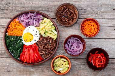 Bibimbap traditional korean food . Asian cooking photography . Top view clipart