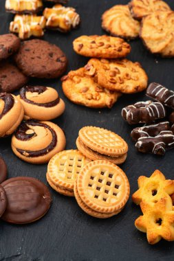 Kurabiye karışımı. Bir sürü sağlıksız atıştırmalık. Üst Manzara. Gıda arkaplanı