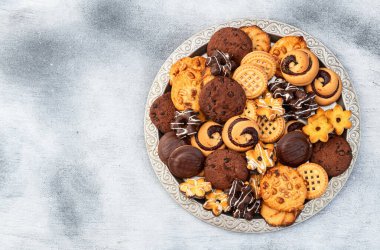 Kurabiye karışımı. Bir sürü sağlıksız atıştırmalık. Üst Manzara. Gıda arkaplanı