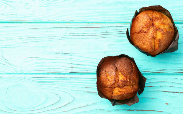 Sweet Baked vanilla muffins ( cupcake )  . Top view photography