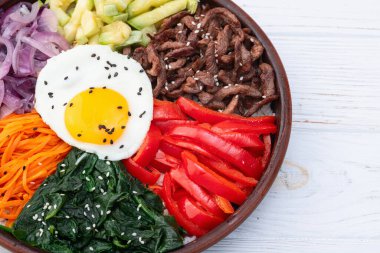 Bibimbap traditional korean food . Asian cooking photography . Top view clipart