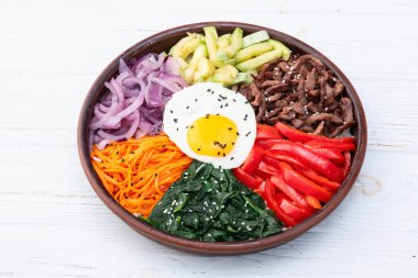 Bibimbap traditional korean food . Asian cooking photography . Top view clipart