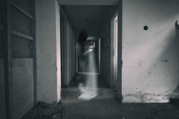 Frightening ghost of a woman in the the dilapidated room