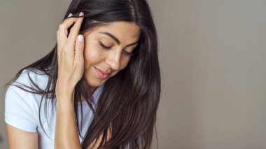 Beautiful Young Brunette Woman with Long Hair and White T Shirt .Woman Portrait with Copy Space