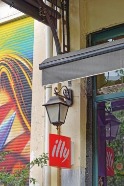 Athens, Greece - May 03, 2015: Italian coffee shop Illy sign at Monastiraki market in Athens.