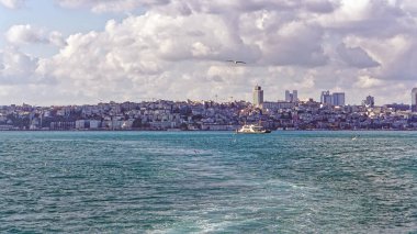 Istanbul cityscape Bosphorus strait blue water clouds sky