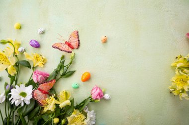 Green spring holiday background with flowers decor eggs
