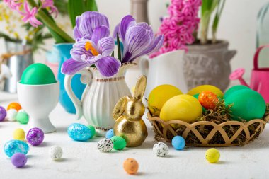 Easter holiday still life with eggs and flowers