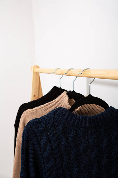 Winter wart sweater  and  hanger close up  clothing concept