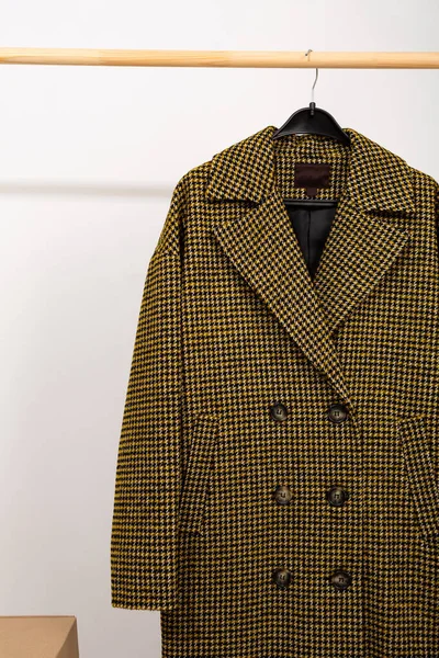 Wool coat on a wardrobe hanger