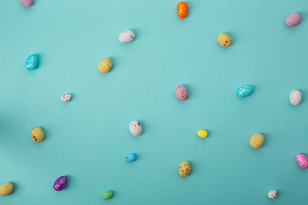 Overhead view of Easter eggs background with copy space