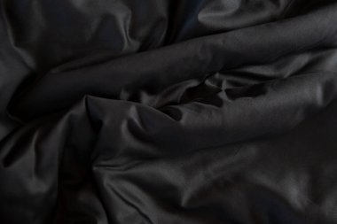 Dalgalı siyah çarşaf dokusu