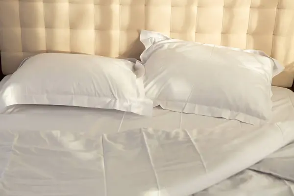 crumpled white bed linen morning routine