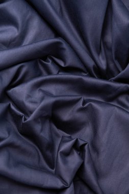 Koyu kumaş, pamuklu yatak örtüsü.