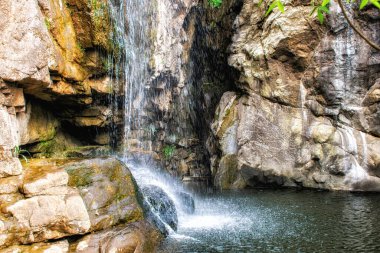a water cascading down a rock face