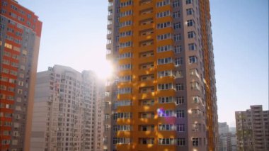 Timelapse of apartment buildings. City sunny day. Fast time lapse urban metropolis