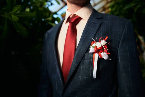 Miscellaneous wedding details. Boutonniere, corset, flowers and more