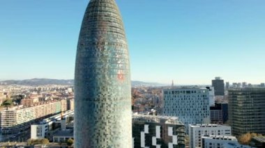 Aerial panoramic view of cityscape with Torre Glories, formerly known as Torre Agbar, 38-story skyscraper, high-tech architecture examples, located in new district of Barcelona in Catalonia in Spain