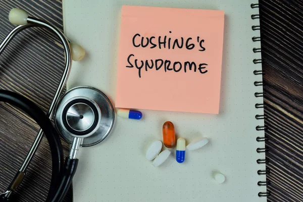 stock image Concept of Cushing's Syndrome write on sticky notes with stethoscope isolated on Wooden Table.