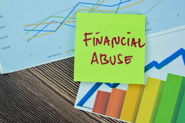 Concept Financial Abuse Write Sticky Notes Isolated Wooden Table — Stock Photo, Image