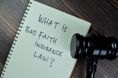 Concept of What is Bad Faith Insurance Law? write on a book with gavel isolated on Wooden Table. clipart