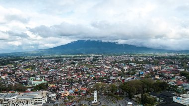 Aerial view of Jam Gadang, a historical and most famous landmark in BukitTinggi City, an icon of the city and the most visited tourist destination by tourists. Bukittinggi, Indonesia, January 25, 2023