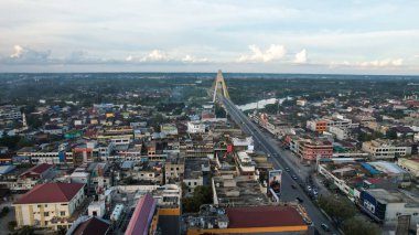 Aerial view of Siak Bridge IV (Abdul Jalil Alamuddin Syah Bridge) above Siak River (Sungai Siak) in Pekanbaru top view. Pekanbaru, Indonesia, January 25, 2023