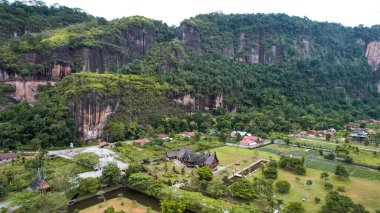Aerial view of Minangkabau house or Rumah Gadang in a beautiful landscape view of Harau Valley with mountains valley and grass view, Beautiful Minangkabau. West Sumatera, Indonesia, january 26, 2023