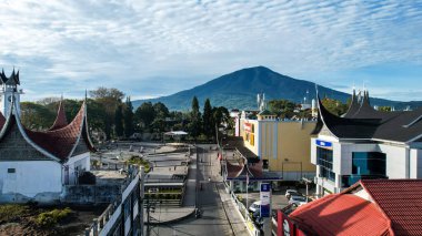 Aerial view of panorama of beautiful countryside of Bukittinggi. wonderful springtime landscape in mountains. grassy field and rolling hills. rural scenery. Bukittinggi, Indonesia, January 28, 2023