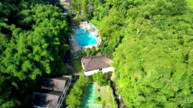 Aerial view of The Plot of land with house and swimming Pool Aerial Shot Top View. Lake Side Villa Puncak. Bogor, Indonesia, February 9, 2023