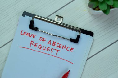 Concept of Leave of Absence Request write on paperwork isolated on Wooden Table.