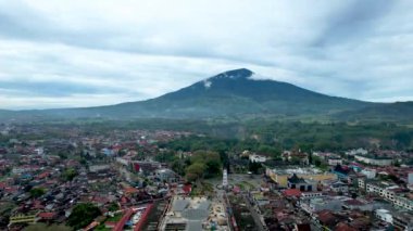 Aerial view of Jam Gadang, a historical and most famous landmark in Bukit Tinggi City, an icon of the city and the most visited tourist destination by tourists. Bukittinggi, Indonesia, February 17, 2023