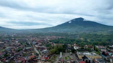 Aerial view of Jam Gadang, a historical and most famous landmark in Bukit Tinggi City, an icon of the city and the most visited tourist destination by tourists. Bukittinggi, Indonesia, February 17, 2023