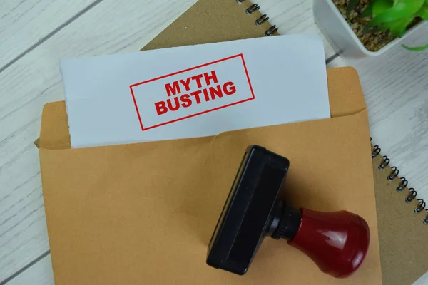 Concept Red Handle Rubber Stamper Myth Busting Text Brown Envelope — Stock Photo, Image