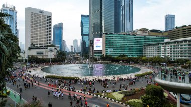 Aerial view of the A crowd of people enjoy Sunday morning near Bunderan Hotel Indonesia area. Car free day is finally back after the number of Covid-19. Jakarta, Indonesia, March 1, 2023