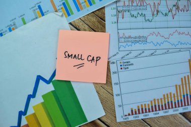 Concept of Small Cap write on sticky notes isolated on Wooden Table.