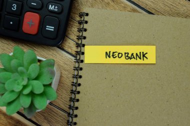 Concept of Neobank write on sticky notes isolated on Wooden Table. clipart