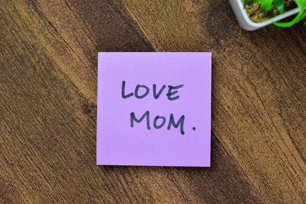 Concept Love Mom Write Sticky Notes Isolated Wooden Table — Stock Photo, Image