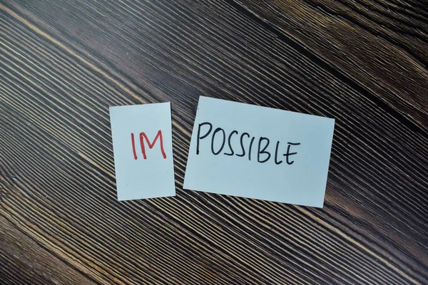 Concept Impossible Possible Write Sticky Notes Isolated Wooden Table — Stock Photo, Image