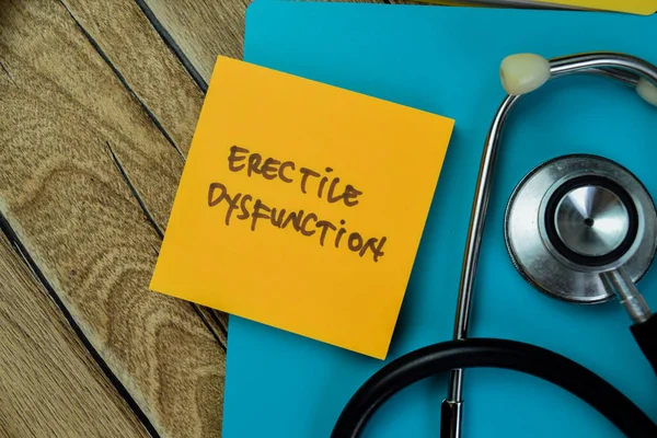 stock image Concept of Erective Dysfunction write on sticky notes with stethoscope isolated on Wooden Table.