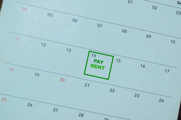 Concept of reminder Pay Rent write on calendar
